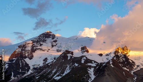 Majestic Snowy Mountain Peaks at Sunset.