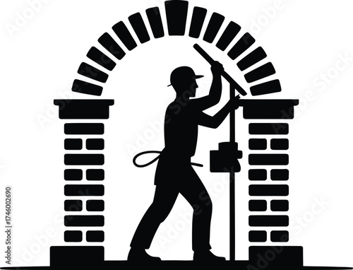 Skilled bricklayer constructing a stone archway depicted as a silhouette