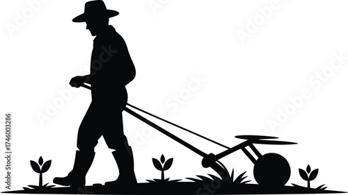 Farmer diligently tending to young seedlings with a cultivator in a field silhouette