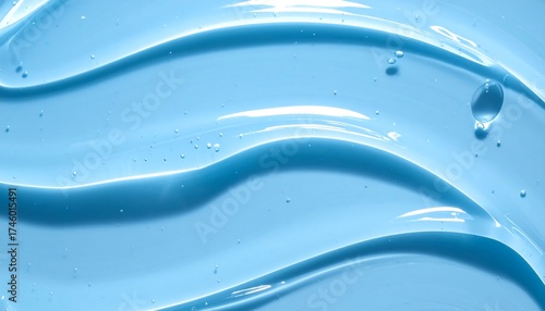 Close-up of swirling, translucent blue gel, with tiny bubbles