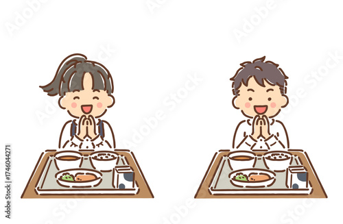 給食を食べようと手を合わせている小学生の男の子と女の子セット