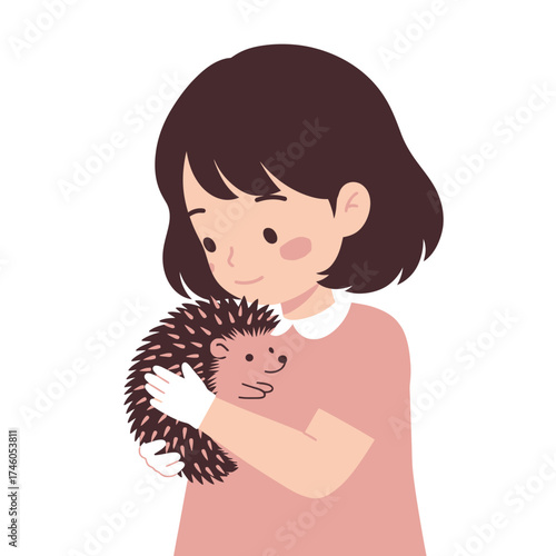 A girl gently holds a hedgehog, showcasing a moment of affection and connection with animals.