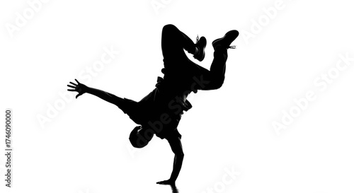 Silhouette of a ballerina in a graceful arabesque pose, leg extended high, arm outstretched.
