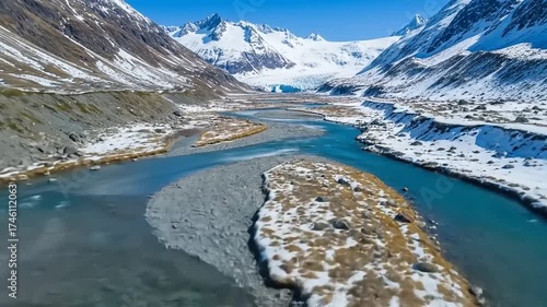 Majestic River Flows Through Snow Capped Himalayan Mountains.