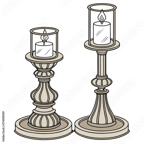 Two elegant antique style candle holders with lit candles inside glass hurricanes on a white background