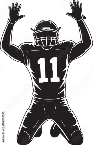 Football player celebrates victory on knees, arms raised high