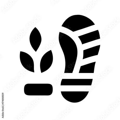 A vibrant close up macro photograph of a dewdrop reflecting the colorful sunrise sky on a green leaf