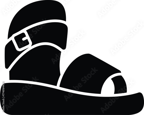 Black silhouette of a comfortable sandal with a buckle and platform sole on a white background