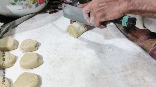 The process of making fried bread buns, or known as Ham Chim Peng, a popular food in Indonesia, Malaysia and Singapore, especially among Chinese descendants.