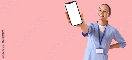 Female doctor holding mobil...