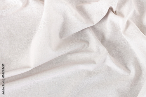 Crumpled white tablecloth a...