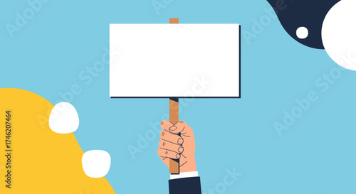A hand holding a blank protest sign in support of a cause or to voice an opinion.
