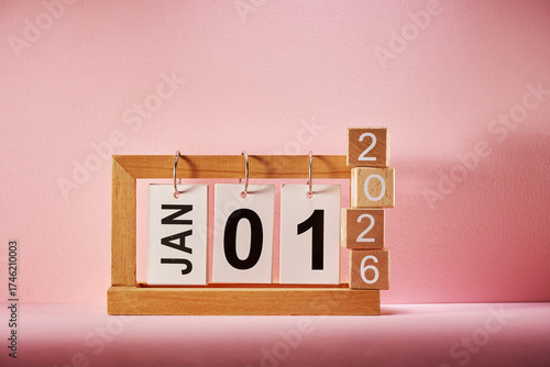 toy block with number 2026 and calendar with Jan 1