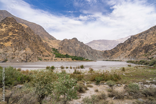 Scenic mountain landscape view of Panj river valley in summer, Darvaz, Gorno-Badakhshan, Tajikistan Pamir	
