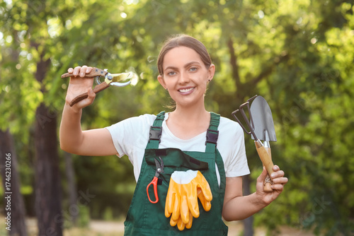 Young female gardener with ...