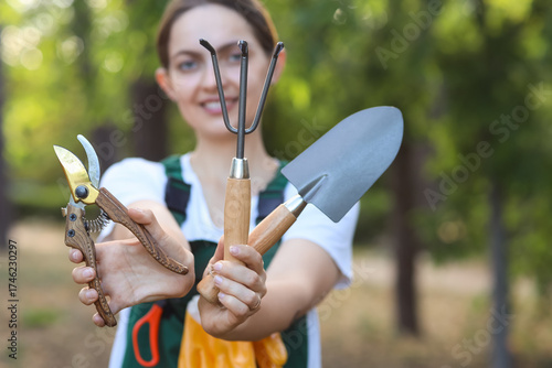 Young female gardener with ...