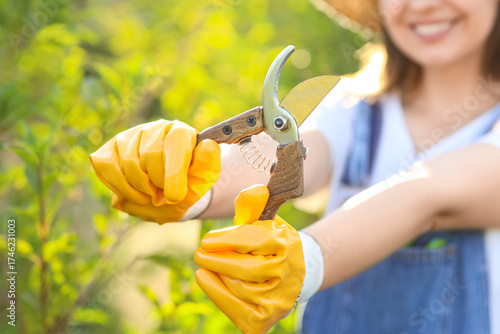 Female gardener with secate...
