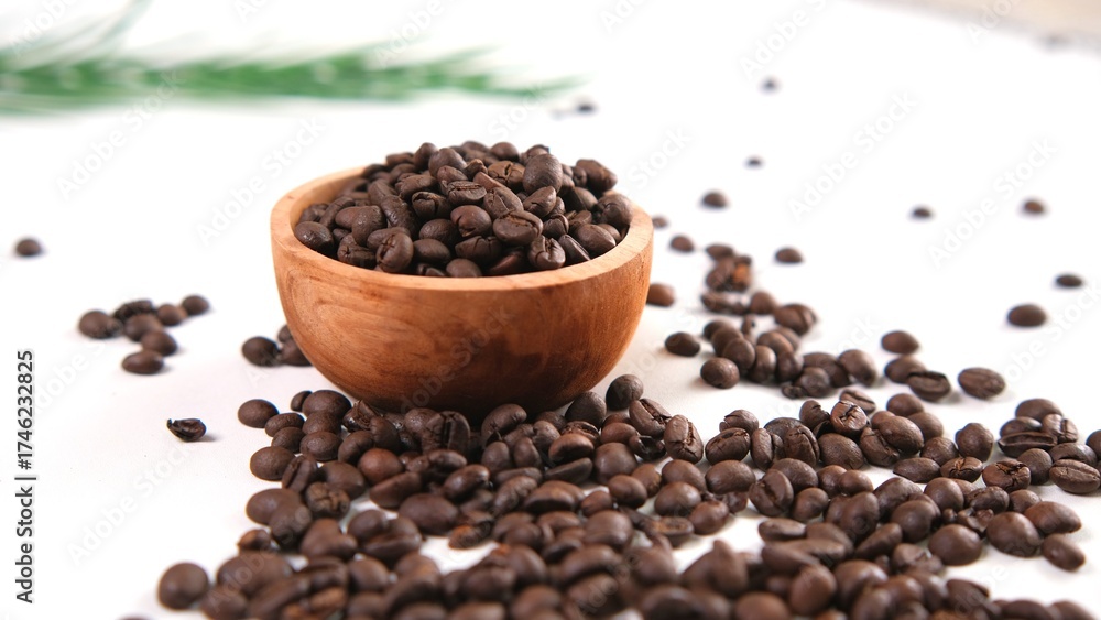 Fototapeta premium Roasted Coffee Beans in Wooden Bowl on White Surface