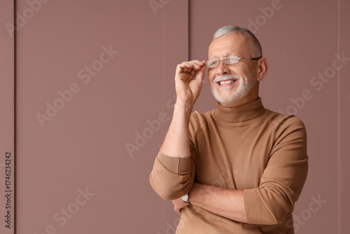Portrait of senior man on b...