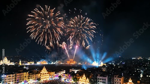 Spectacular Midnight Fireworks Display Over City Skyline with Vibrant Colorful Explosions and Illuminated Landmarks Celebrating a Festive Occasion