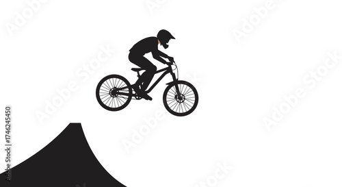 Silhouette of a Mountain Biker Performing a Jump in Minimalist Style