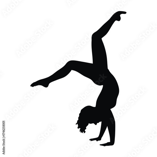 Silhouette of a person performing a dynamic handstand and backbend pose