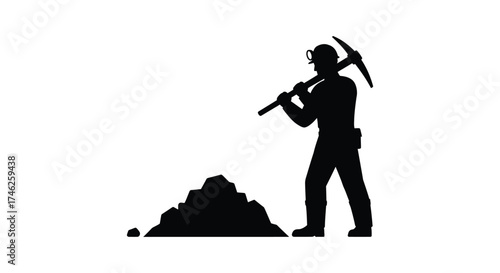 Silhouette of a miner digging with a pickaxe in a pile of rocks symbolising hard work and mining industry
