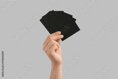 Female hand with blank blac...