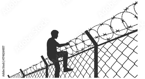 Determined person silhouetted climbing over a barbed wire fence seeking freedom or escape with hope