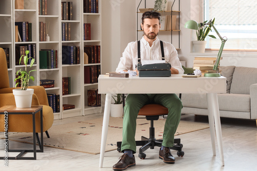 Young male writer with vint...