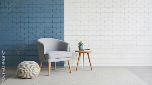 Modern living room corner with gray armchair and textured wall