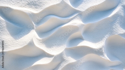 Abstract texture of white powder, sand, or icing sugar.  Soft, flowing, and wavy patterns.