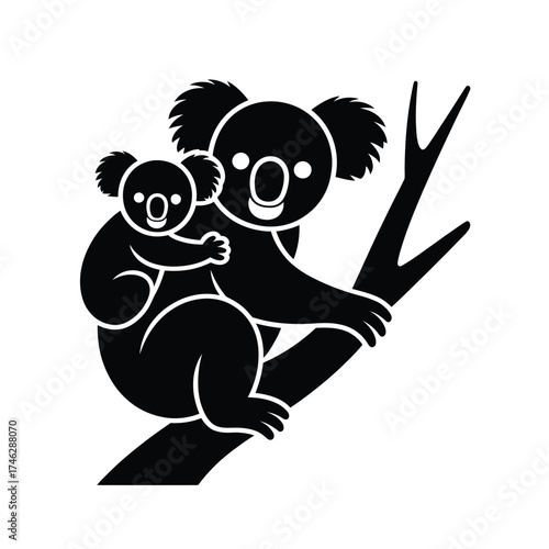 Silhouette of a mother koala with joey on a tree branch