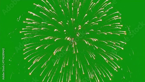 Golden firework explosion on a green screen, an isolated VFX element for motion graphics and celebratory event design