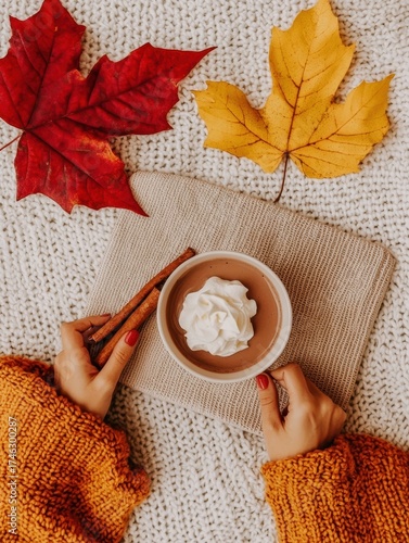 Cozy Autumn Scene with Hot Chocolate and Colorful Leaves