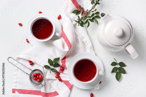 Cups and teapot of hot rose...