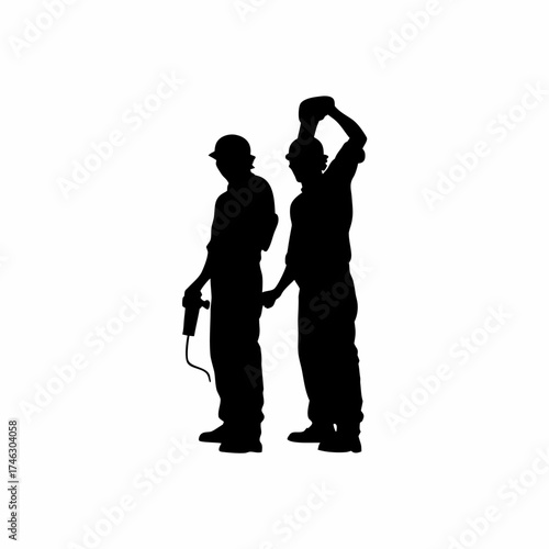 Silhouette of two welders working under dim light on white background isolated on white background