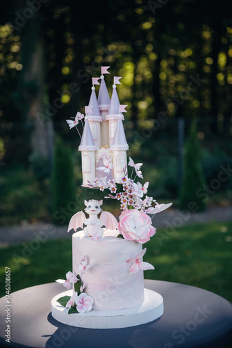 Beautiful birthday cake with dragon and castle, delicious meal, natural lighting