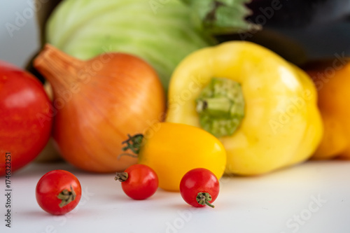 fresh vegetables. tomatoes, bell peppers, onions on a white background