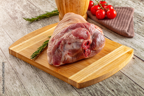 Raw pork knuckle over board