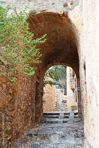 Fototapeta Naklejka Na Ścianę i Meble -  Narrow stone streets and passageways are typical of the architecture of the medieval walled town of Monemvasia in Greece