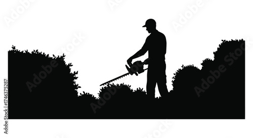 Silhouette of a gardener using hedge trimmers to meticulously shape bushes and shrubs in a garden outdoors