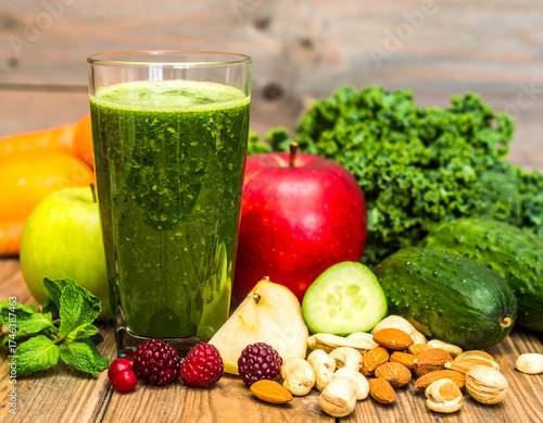 Green smoothie in glass jar with straw, fruits , health drink concept,