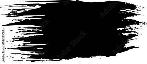 A black brush stroke or paint smear with textured edges on a white background, creating an abstract shape.