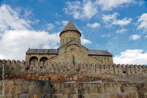 The outside view of Svetitskhoveli Cathedral which is an Orthodox Christian cathedral located in the historic town of Mtskheta, Georgia, The cathedral  is surrounded by a stone wall