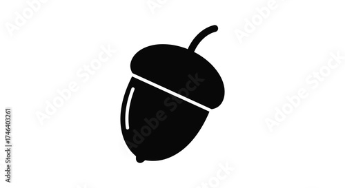 Simple black silhouette of an acorn symbolizing nature growth autumn and oak tree seed silhouette