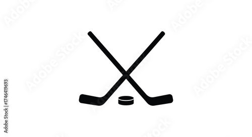 Crossed hockey sticks and puck silhouette symbol representing ice hockey sport and game play silhouette