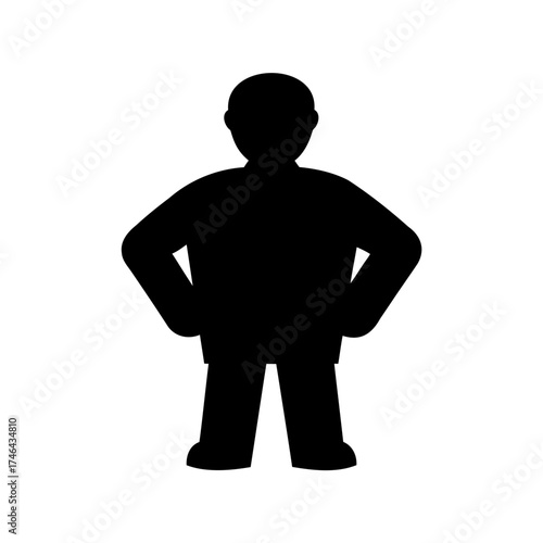 Silhouette of a person standing with hands on hips and ready