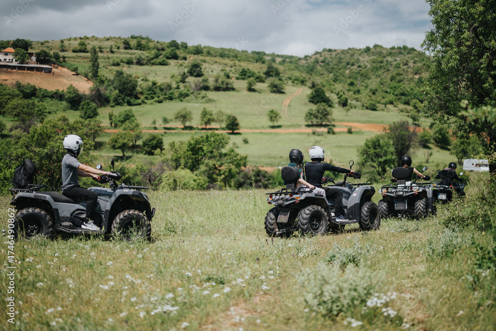 Obraz premium A lively group of friends enjoys an adventurous ride on quad bikes across picturesque fields and hills, emphasizing outdoor exploration, camaraderie, and thrilling escapades in nature.