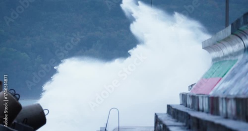 Stormy Huge Waves Breaks Against Sea Port Pier and Lighthouse coast of Varna City Bulgaria